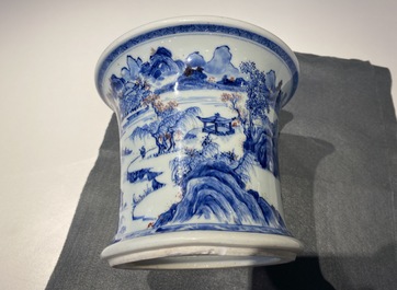 A fine Chinese blue, white and copper red 'Master of the Rocks' brush pot, Kangxi